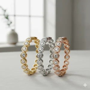 Three diamond bezel bracelets side-by-side, illustrating the yellow gold, white gold, and rose gold metal options.