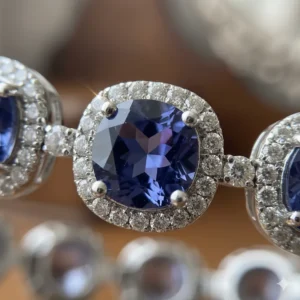 Macro view highlighting the rare blue-violet color and pleochroism of the tanzanite stones in the bracelet.