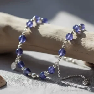 Casual and fashionable tanzanite bracelet featuring small, polished tanzanite beads strung on a sterling silver chain.
