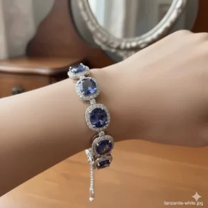 Close-up shot of an elegant oval-cut tanzanite bracelet sparkling beautifully on a model's wrist.
