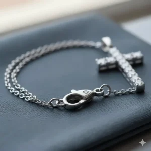 Close-up of a white gold diamond cross bracelet clasp.