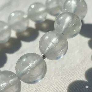 Detailed close-up shot of an icy jadeite bead bracelet, showing the translucent texture and natural variations of the jade gemstone.