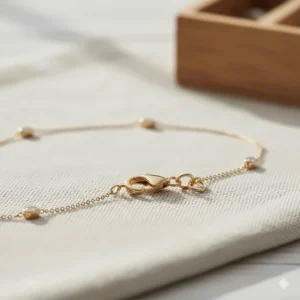 Clear view of the lobster claw clasp detail on a delicate diamonds by the yard bracelet chain.