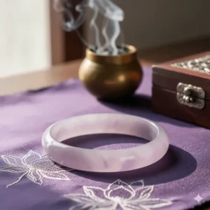 Photo of a soft lavender jade bracelet representing its spiritual meaning of purification, wisdom, and emotional healing.