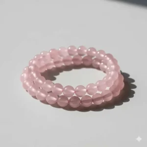 Individual pink crystal bracelet made from natural rose quartz, photographed cleanly on a neutral background for product listings.