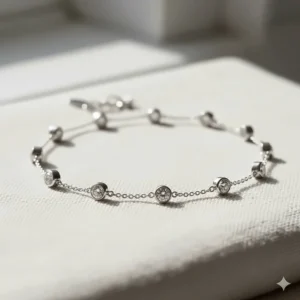 A sparkling white gold diamond station bracelet, often called a diamonds by the yard bracelet.