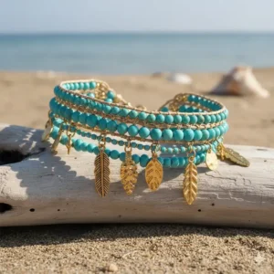 Bohemian style multi-strand turquoise bead bracelet with gold charms.