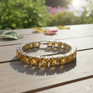 The citrine tennis bracelet sparkling beautifully as it catches the sunlight outdoors.
