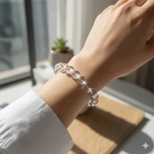 Model wearing a simple, elegant clear quartz bracelet on her wrist, perfect for everyday meditation and fashion.