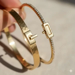 Detailed view of the hidden safety clasp on a premium stackable gold bangles set.