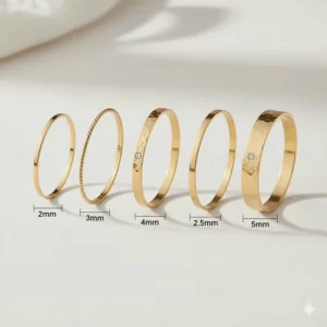 Comparison of different widths within a stackable gold bangles set ranging from 2mm to 5mm.