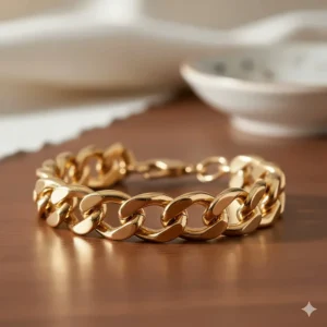 Close-up shot of the polished 14k gold links on a chunky chain bracelet for women.