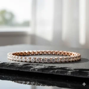 Women’s rose gold tennis bracelet encrusted with small round-cut diamonds.