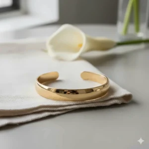 Simple and elegant solid gold bridal cuff bracelet for a modern minimalist wedding look.