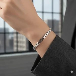 A thick sterling silver box chain bracelet showcasing a geometric, modern aesthetic.