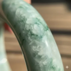 A detailed macro shot of the internal grain and texture of a natural jade bangle.