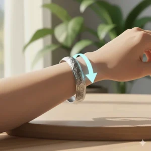 High-detail image showing a cuff bracelet being applied by sliding the opening over the side of the narrowest part of the wrist.