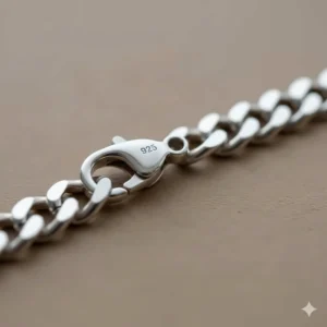 Detailed view of the secure lobster claw clasp on a 925 sterling silver chain bracelet.