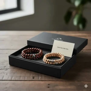 A set of polished wooden bead bracelets for men presented in a premium sustainable gift box.