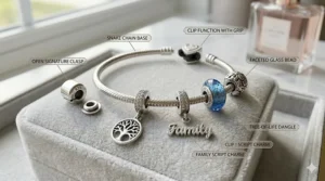 A Pandora style charm bracelet presented in a luxury white gift box with a silk ribbon.