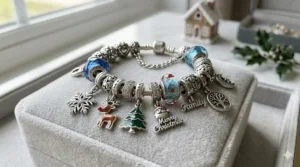 Festive winter-themed Pandora style charm bracelet featuring snowflake and enamel reindeer charms.