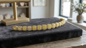 A vibrant yellow diamond halo tennis bracelet set in 18k white gold.