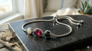 An illustrative sizing guide for a gemstone bolo bracelet in sterling silver, demonstrating how the adjustable closure fits wrists from small to large sizes.