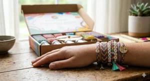 Examples of custom styles made with a friendship bracelet making kit including initial beads and heart charms.