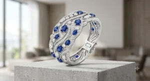 A luxury diamond and blue sapphire cuff bracelet in white gold.