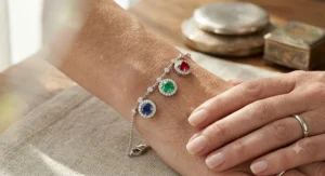 Luxury 14k white gold family birthstone bracelet for mom accented with brilliant pavΓ© diamonds around each gemstone.