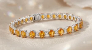 An elegant sterling silver tennis bracelet featuring vibrant oval-cut citrine stones alternated with brilliant round diamonds.