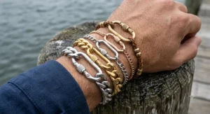 Layered stack of gold and silver carabiner bracelets made from premium stainless steel