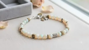 A bohemian style beaded bracelet showcasing genuine white opal smooth round beads as a meaningful October birthstone gift.