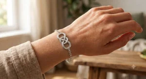 Interlocking double infinity loop bracelet crafted in polished white gold for women.