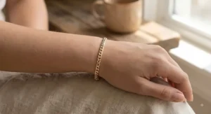 Adjustable two-tone gold link bracelet showing exact sizing for small wrists
