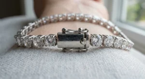 Close-up detail of the double-latch safety box clasp on a cubic zirconia tennis bracelet.