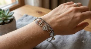 Hypoallergenic stainless steel charm bracelet featuring delicate dangle charms