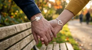 Illustration of sterling silver matching puzzle bracelets for couples featuring interlocking heart pieces that fit together.