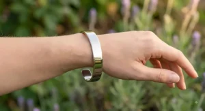 Close up view of a nickel free titanium cuff bracelet with a smooth polished finish