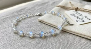 Rainbow moonstone gemstone bracelet showing blue flash, ideal for a June birthday present