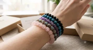 Stackable rose quartz bracelet for anxiety relief layered with natural gemstone bead bracelets