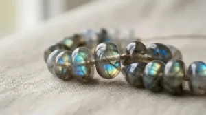 Close-up of a handmade labradorite bracelet for meditation showing iridescent blue flash on the beads.