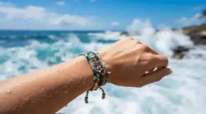 A close-up of a hemp cord bracelet for beach style worn by a surfer on a sunny coast.