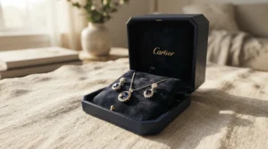 An elegant gift box containing a glowing pearl bracelet for sensitive skin resting on soft velvet.