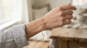 A minimalist silk cord bracelet for delicate jewelry elegantly styled and worn on a wrist.